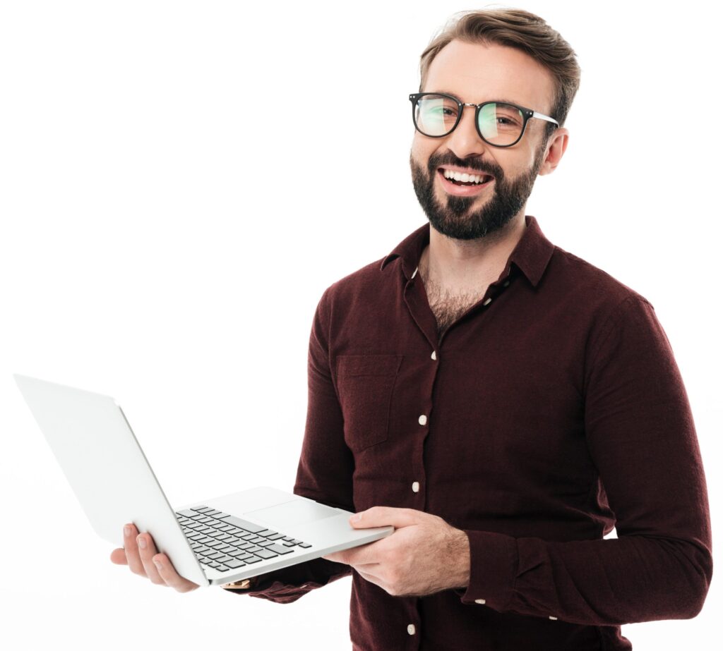 A man holding his laptop while smiling